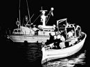 Italian coast guard intercepts an Algerian vessel with illegal immigrants, trying to disembark on the island of Lampedusa.
