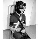 Detainee being bound to a chair for the deportation. Picture from the training material of the Zurich police.